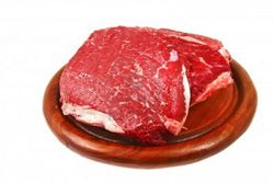 Raw-bloody-beef-steak-on-wooden-plate